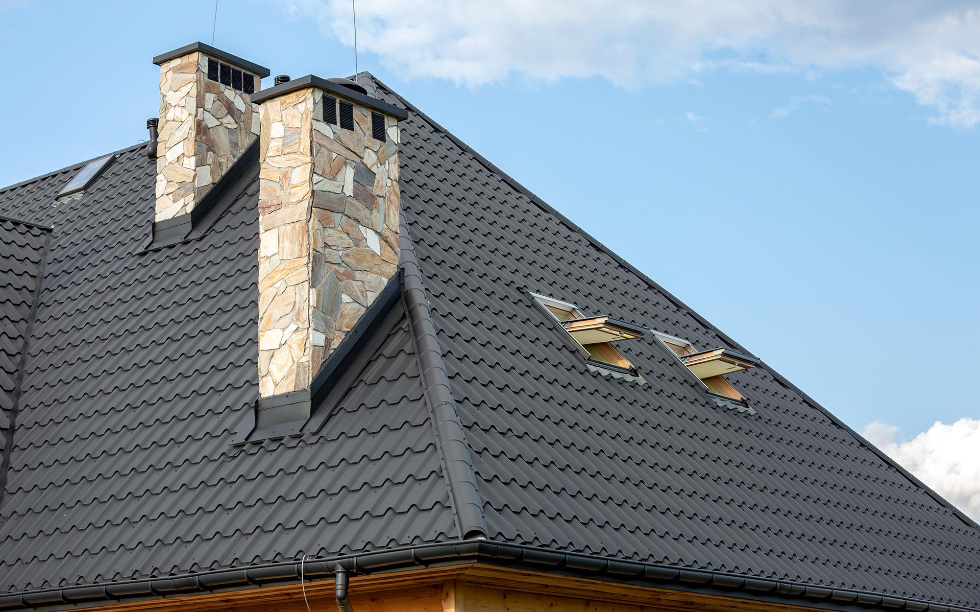 Side View Of A Residential Roof With Metal Shingles