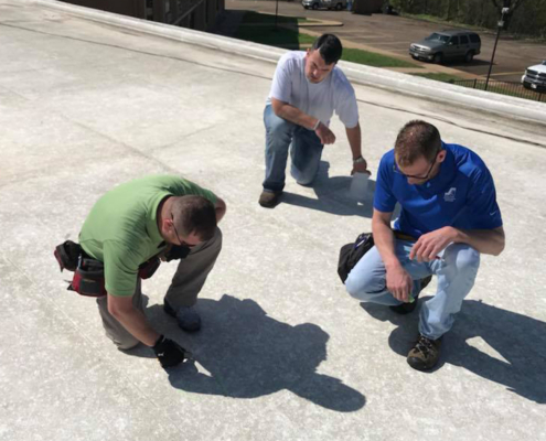 Three Men Conducting Roof Inspection